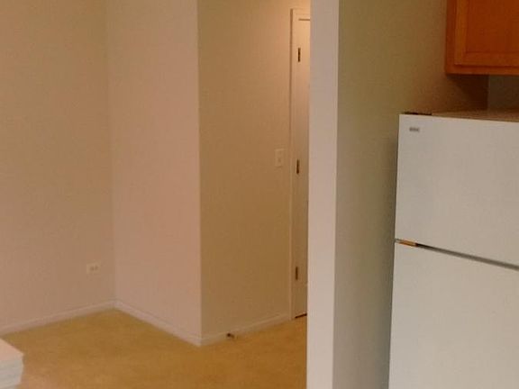 View from kitchen to dinette & powder room