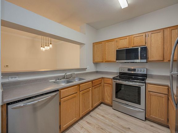 Kitchen with newer stainless steel appliances.