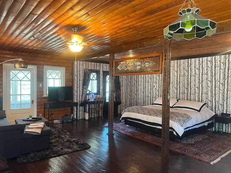 Ceiling fan, TV, Desk with make-up mirror with light, clock and lamp.