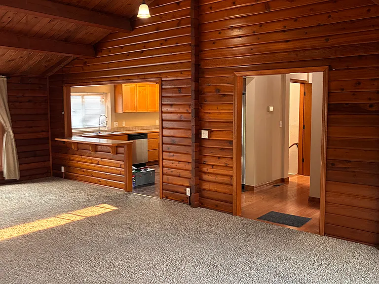 Living area with dining space and breakfast bar.