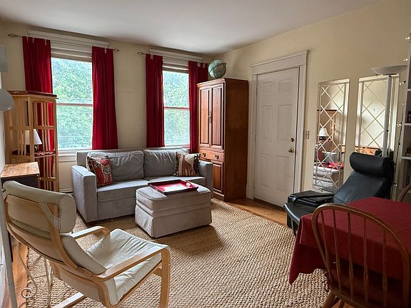 Living room and front entrance.