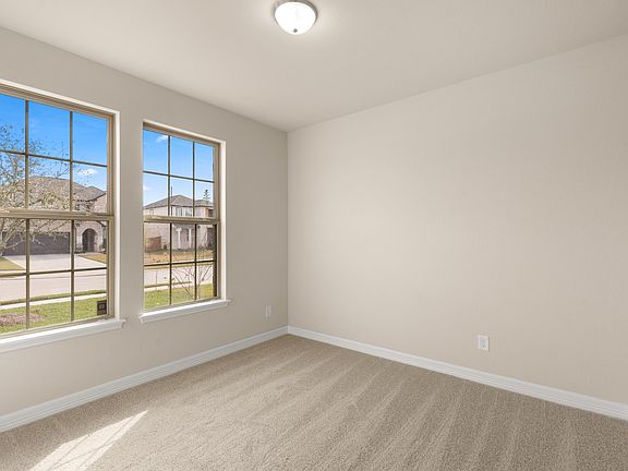 The third bedroom features plush carpet, fresh paint and large windows allowing plenty of sunshine i