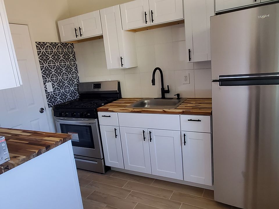 Brand new kitchen cabinets, appliances, and fixtures.