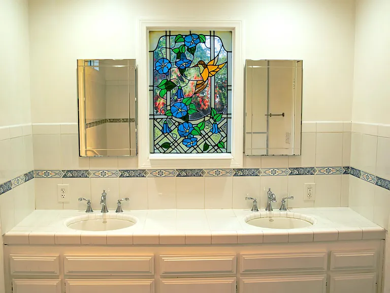 Master bath stained glass window.