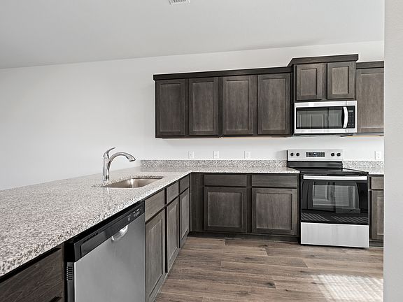 The kitchen has a wonderful breakfast bar.