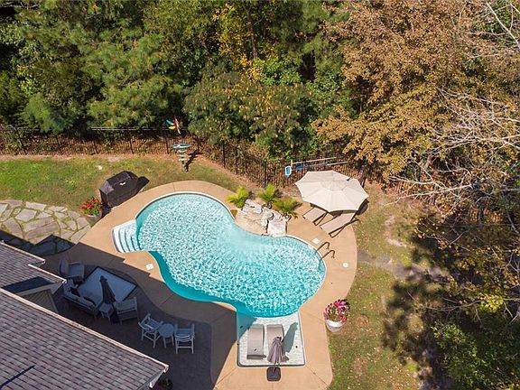 Heated, chlorine pool with waterfall. 