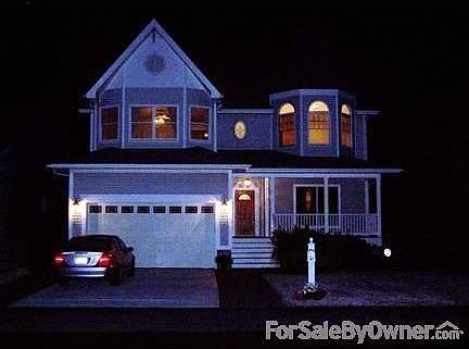 Front of the house at night.