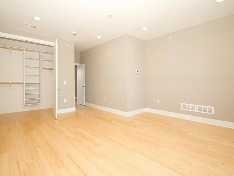 Main bedroom with ample natural light and walk-in closet