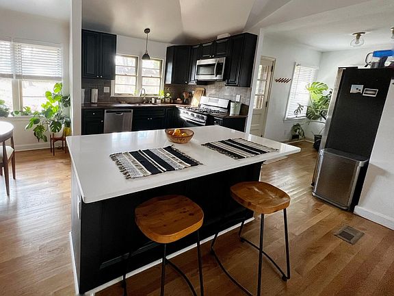 Kitchen, island and nook/mudroom.