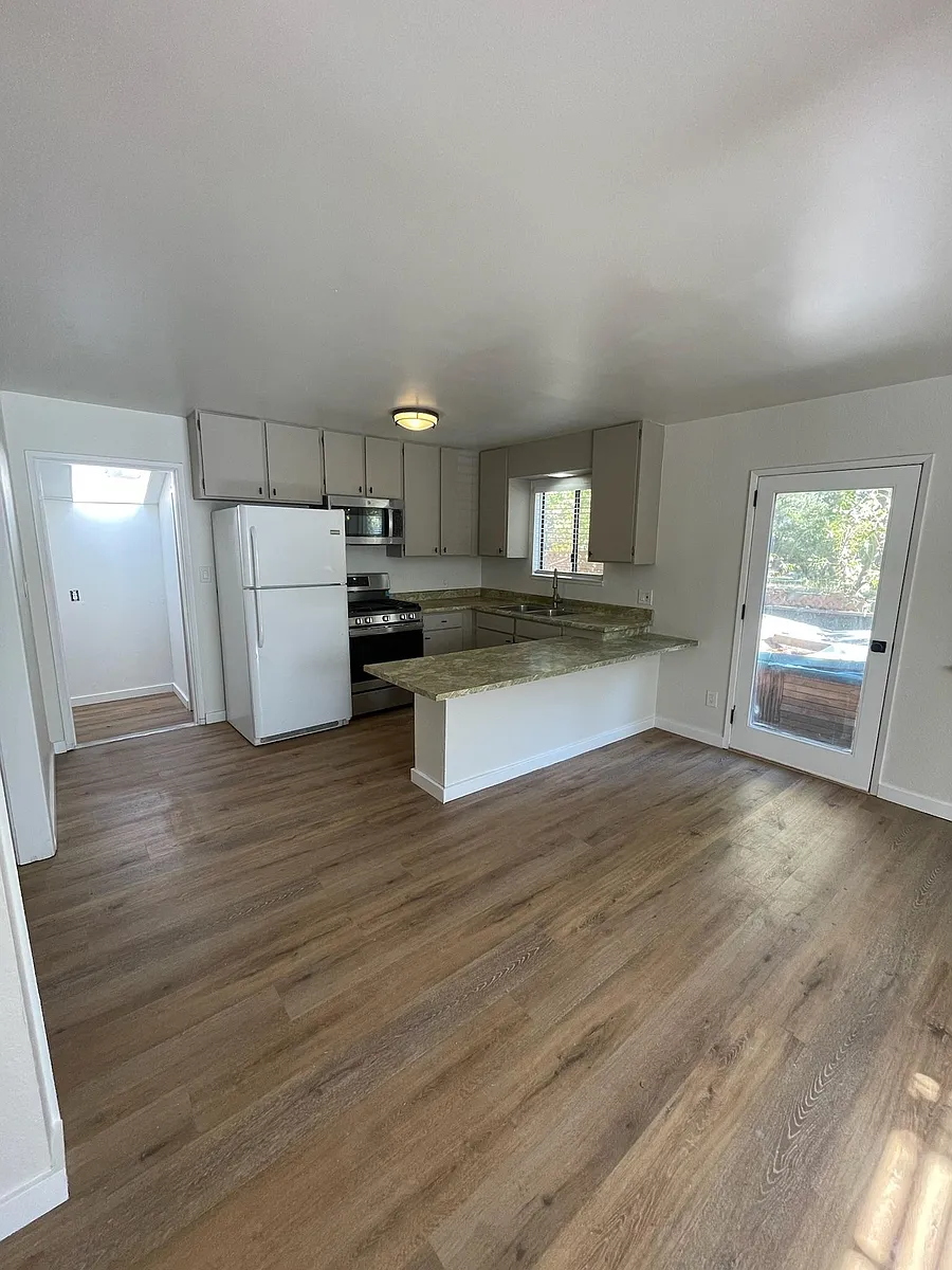 New gas range and microwave. Laundry room in back. - 2709 Armstrong Ave