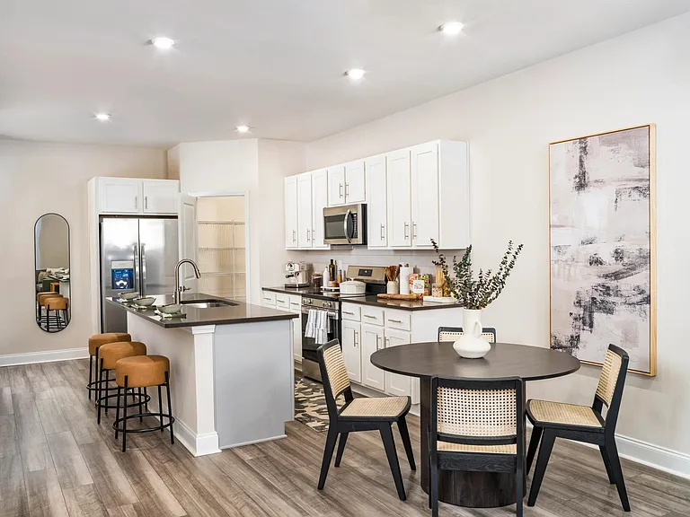 Unleash your inner chef and effortlessly entertain with the large chef's island, featuring built-in storage.