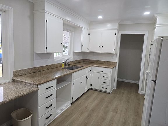 Granite counter tops with space for business desk or large counters for food prep.