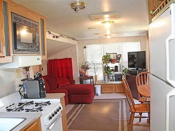 How a resident decorated before this unit was remodeled with new floor, ceiling etc... Living room can fit couch and recliner.