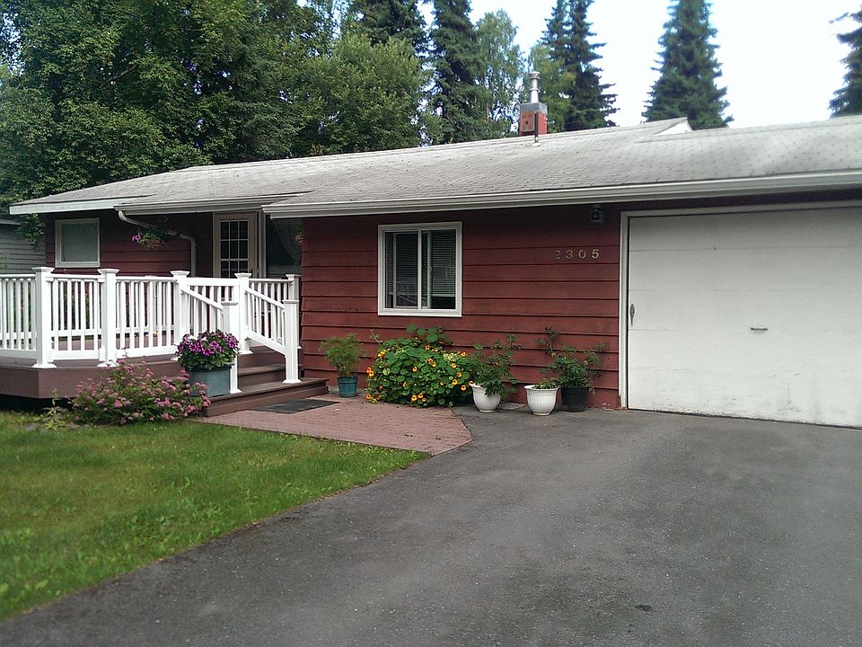 Main entrance, deck, garage