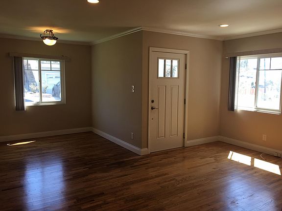 FRONT ENTRANCE AND OPENING TO LIVING ROOM