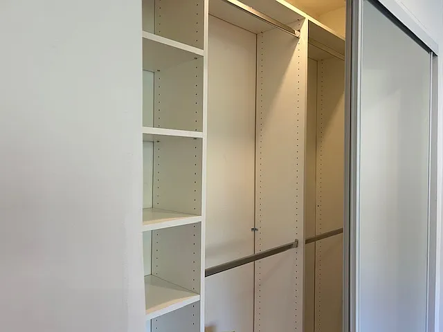 Fully adjustable custom closets with separate lighting.