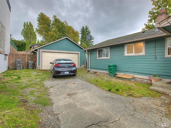 Level parking area at back/side door.  Enough room to turn around or park another vehicle.  Extra large rebuilt 2 car garage