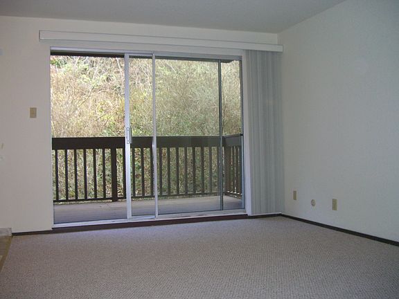 Living room with sliding door to private deck