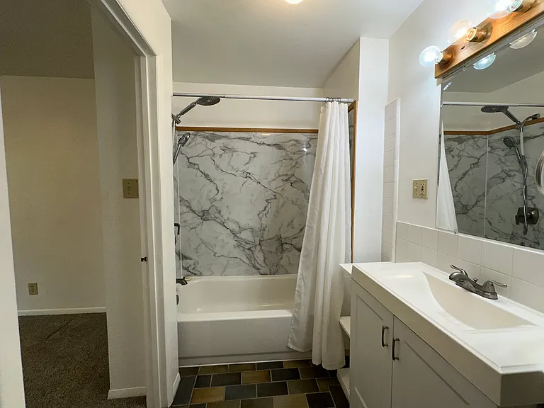 Bathroom with tub and shower