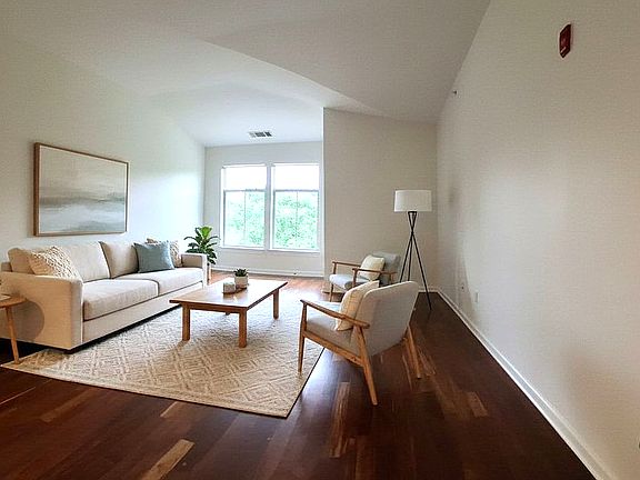 Spacious Great Room with Vaulted Ceilings and Caribbean Rosewood Flooring (Virtually Staged)