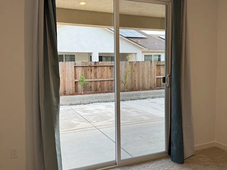 Another angle of sliding glass door to backyard.