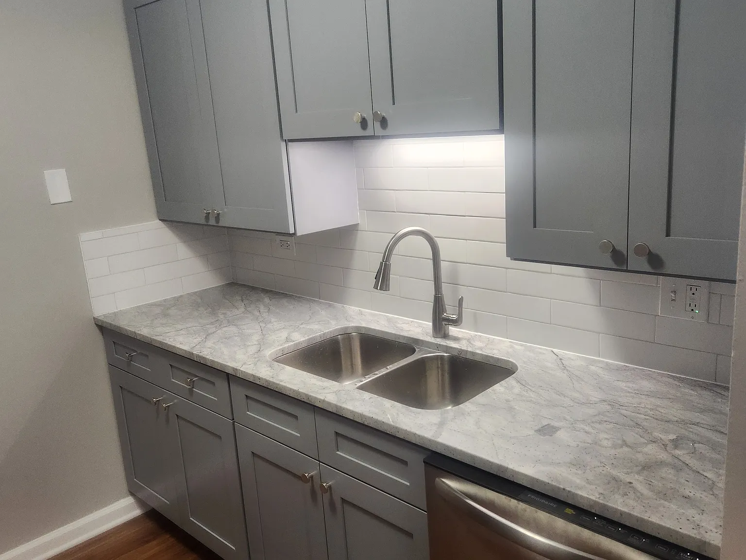Brand new counter tops, sink, faucet, cabinets and dishwasher
