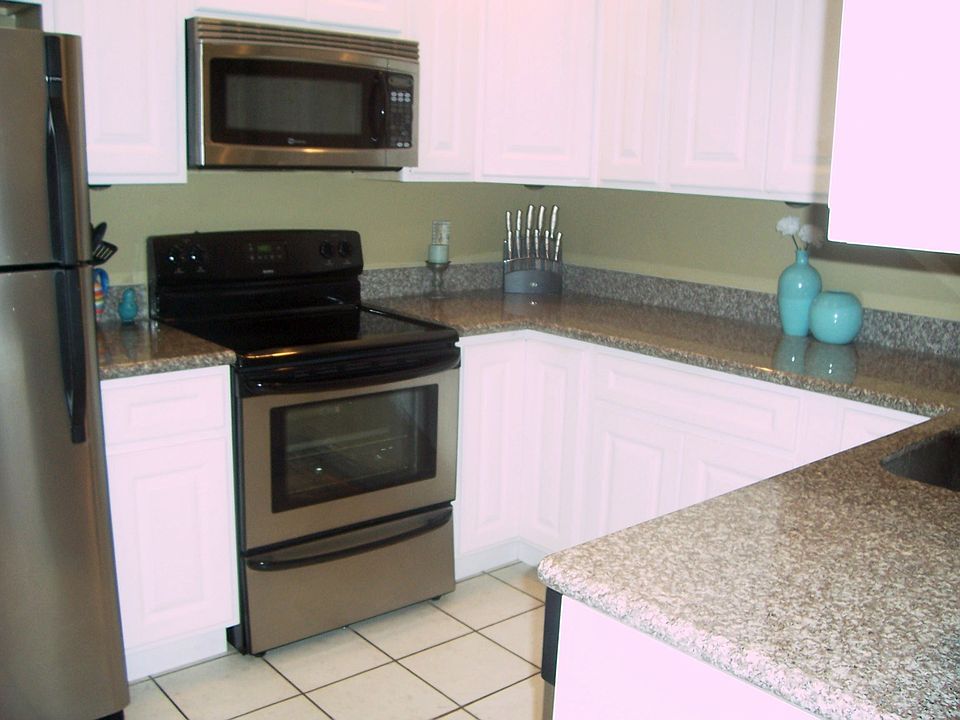 New Granite Countertops, 42" Raised Panel Cabinets, Stainless Steel Appliances