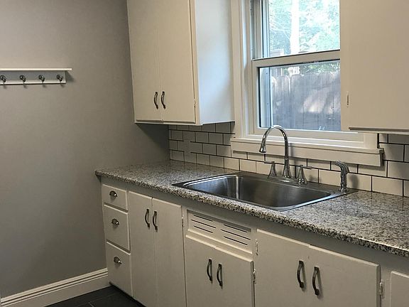 Kitchen with new floors, new Kohler sink & new granite count