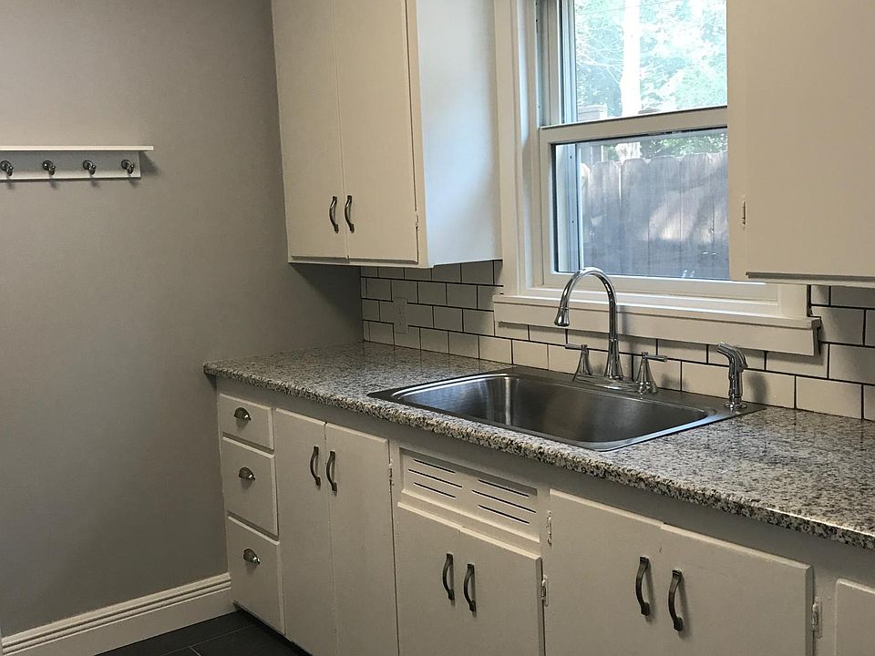 Kitchen with new floors, new Kohler sink & new granite count