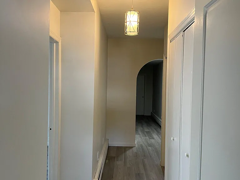 view down long hallway from front door
