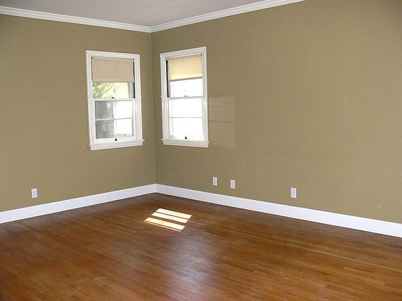 Large master bedroom with hardwood flrs
