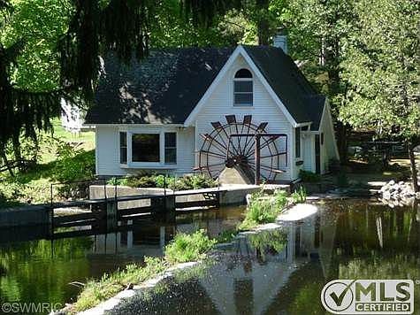 Across the river, the original water wheel and the dam.