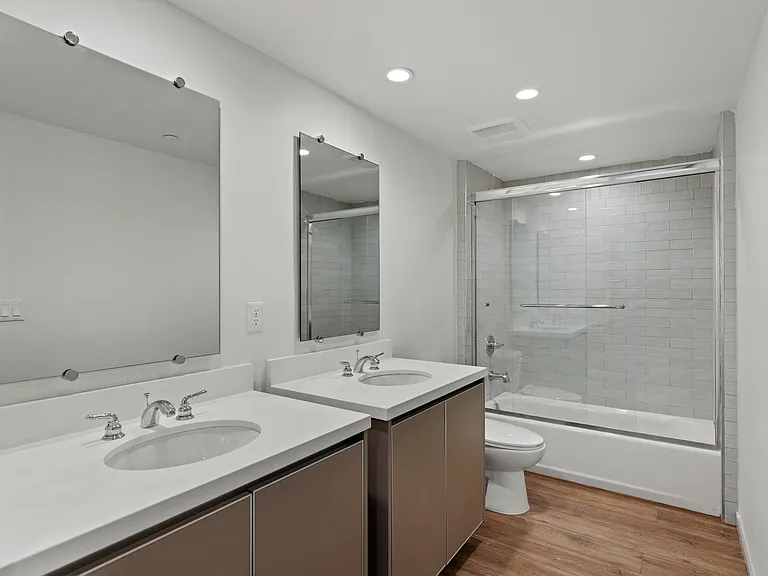 Bathroom with Double Vanity and Shower Bath with Glass Door