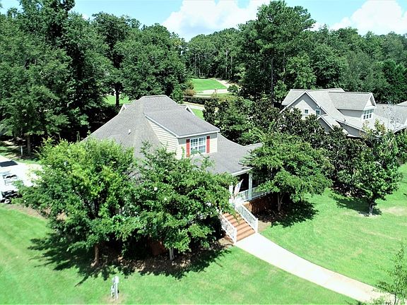 Image 4: Beautiful Trees Shade the Back Porch