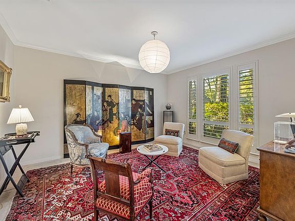 Elgant formal dining room with crown moulding and plantation shutters. This room is great for entertaining.