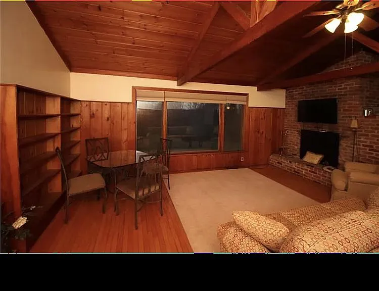 Livingroom with picture window overlooking the backyard