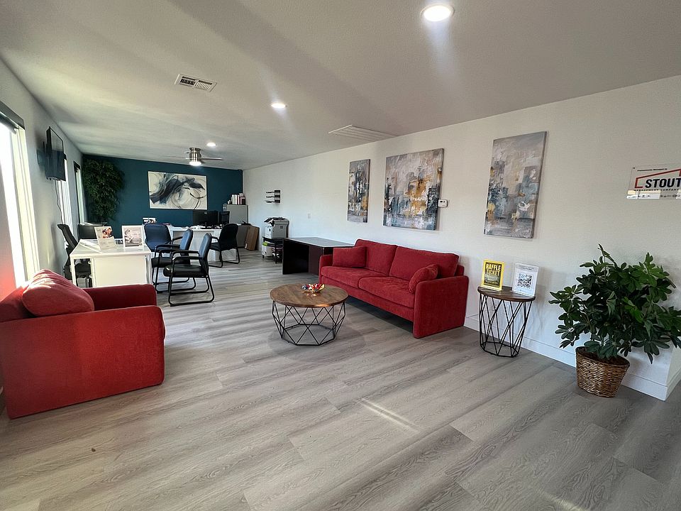 Experience the perfect blend of comfort and functionality in this beautifully designed living and office area.