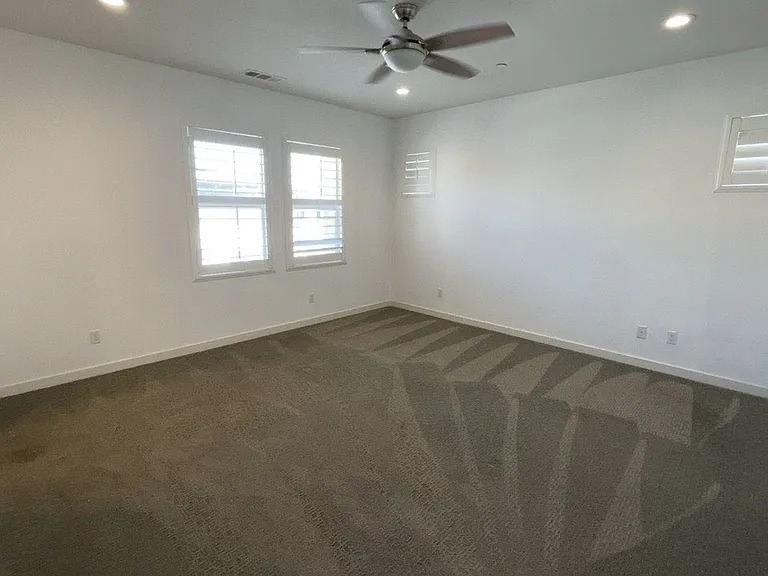 3rd floor - Primary bedroom with bathroom, large walk in closet with built in storage cabinets
