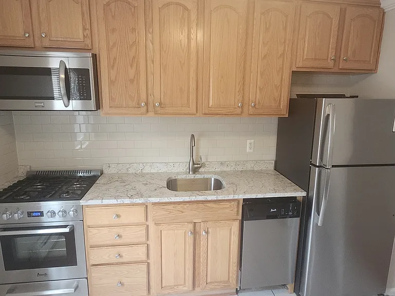 kitchen with granite counters and stainless steel appliances