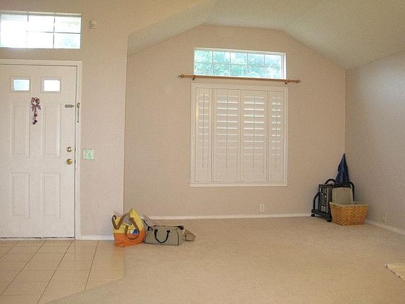 Louvered Window Treatmets in front living room