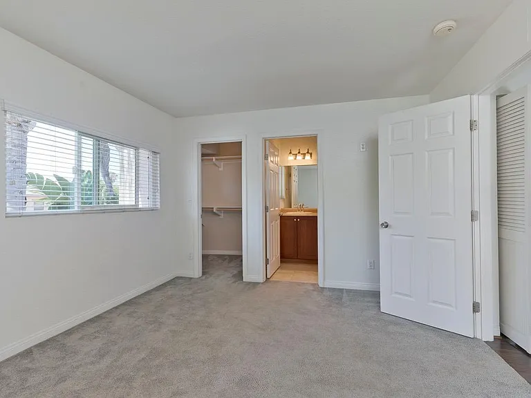 Bedroom 2 of 3 with walk-in closet and private bathroom