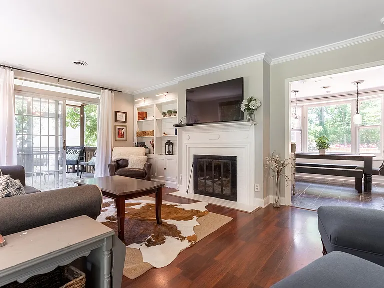 Notice the opening to the dining room and views through the bay window of the back yard.