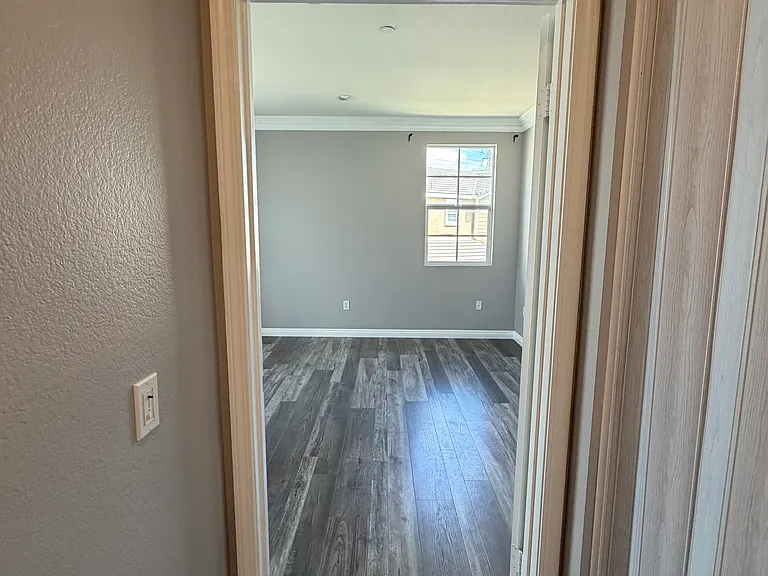Hallway view of primary bedroom.