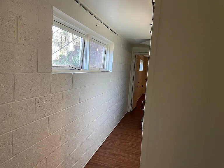 Looking from Foyer down Hallway to den and living room