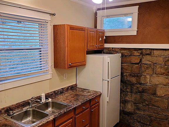 Exposed rock wall in kitchen