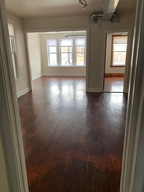 Kitchen view into Dining Room, Living room and 1 of 3 bedrooms on the right