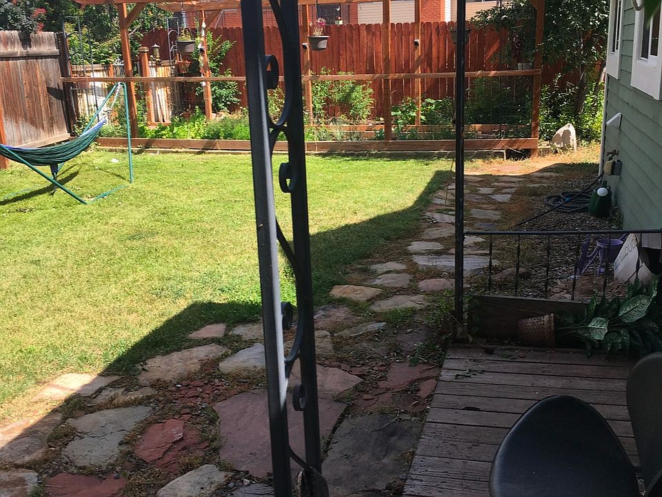 front door opens to grassy yard