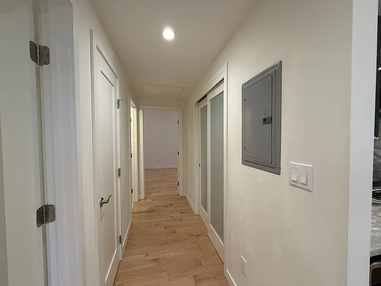 Hallway with 2 storage closets.
