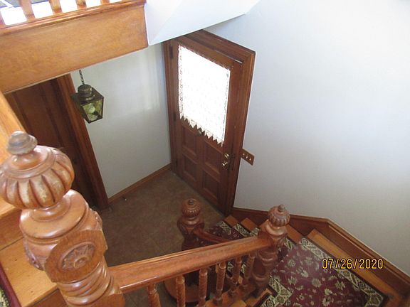 Ground floor entrance with staircase up to apartment