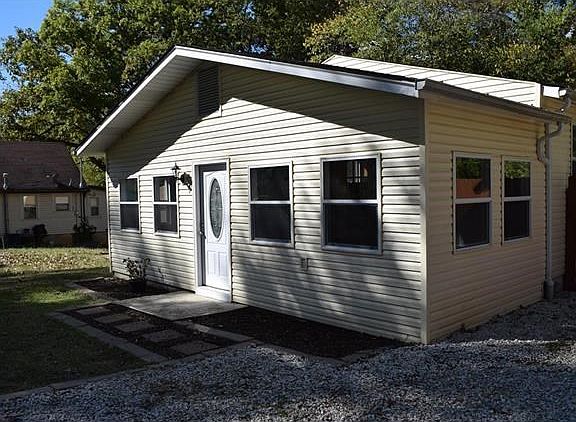 Right side of home and paver path in front.